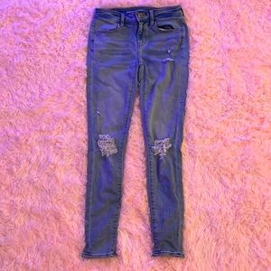 Stretchy, short, ripped, light colored jeans.